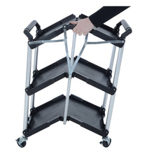 Load image into Gallery viewer, Folding up the Azuma wheeled service trolley cart. 
